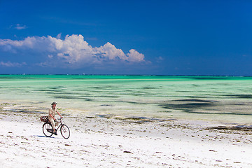 Image showing Cycling along tropical beach