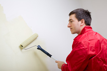 Image showing Man painting a wall
