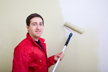 Image showing Man painting a wall