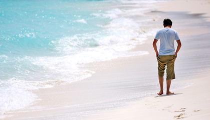 Image showing Man walking beach