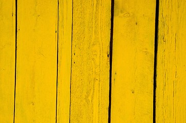 Image showing Wall made of yellow wooden planks. 