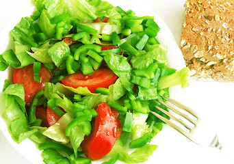 Image showing Healthy vegetarian Salad and bread on the white plate