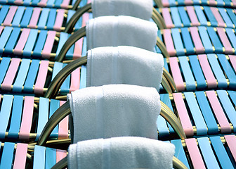 Image showing Lounge chairs and towels.