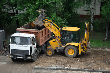 Image showing Tractor. Cleaning the yard