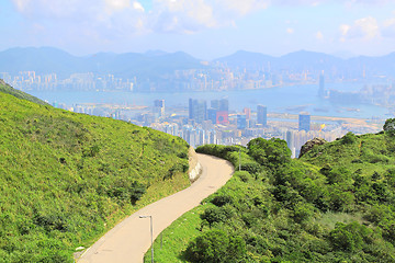 Image showing Asphalt winding curve road to city