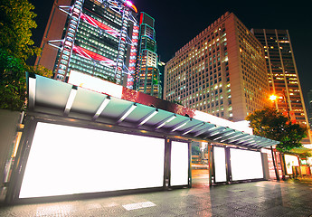 Image showing Blank billboard on bus stop at night 