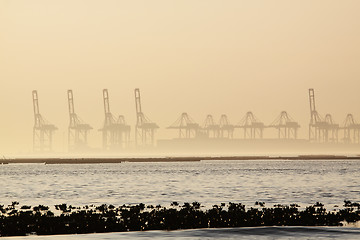 Image showing container cranes on a foggy morning