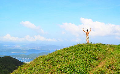 Image showing Beautiful mountains landscape with lake in hongkong and man on t