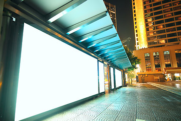 Image showing Blank billboard on bus stop at night 