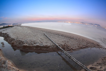 Image showing Tropical sunset on the beach.