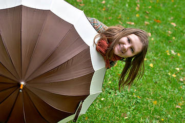 Image showing Beautiful young woman with umbrella