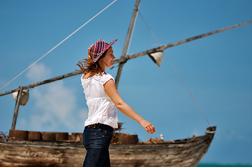 Image showing Young girl and boat