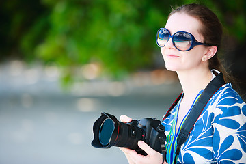 Image showing Portrait of beautiful woman with camera