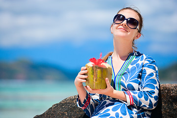 Image showing Young woman with coconut