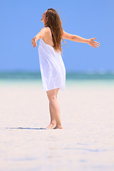 Image showing Young woman dancing at beach