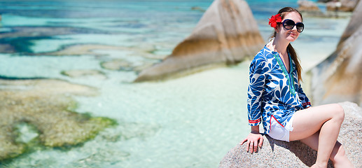 Image showing Woman sitting on top of granite rock