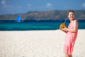 Image showing Young woman with coconut