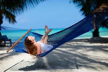 Image showing Woman relaxing in hammock