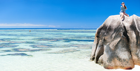 Image showing Woman sitting on top of granite rock