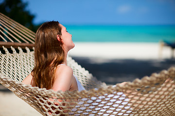 Image showing Woman relaxing in hammock