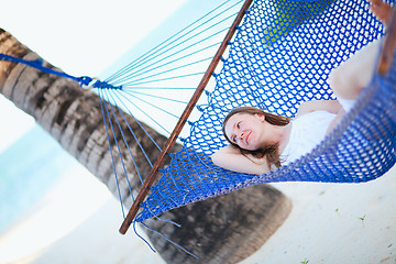 Image showing Woman relaxing in hammock