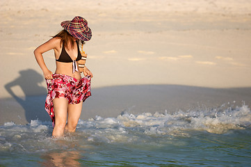 Image showing Young girl splashing water