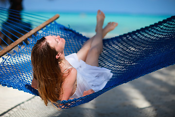 Image showing Woman relaxing in hammock