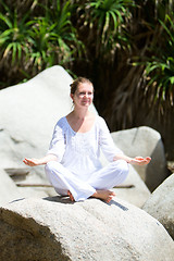 Image showing Woman practicing yoga outdoors