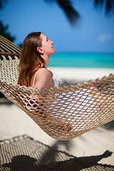 Image showing Woman relaxing in hammock