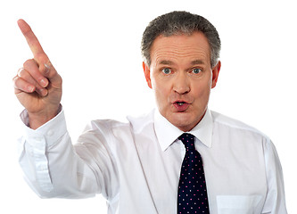 Image showing Businessman pointing at copy space