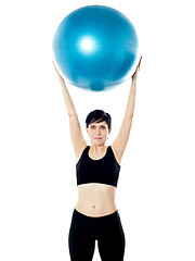 Image showing Beautiful woman holding pilates ball