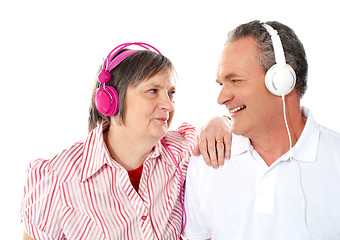 Image showing Romantic senior couple enjoying music together