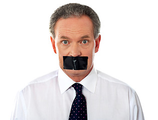 Image showing Businessman with taped mouth