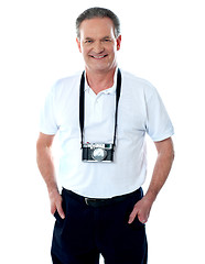 Image showing Mature cameraman posing smartly