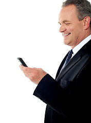 Image showing Business executive reading text sms