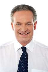 Image showing Smiling senior corporate man. Closeup
