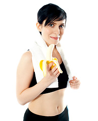 Image showing Pretty woman with banana