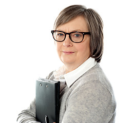 Image showing Attractive old orporate lady holding business document