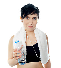 Image showing Young sporty woman with towel isolated