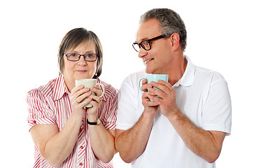 Image showing Happy matured couple holding cofee mug