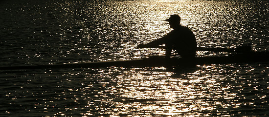 Image showing Rowing alone