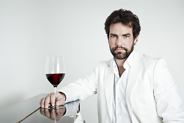 Image showing handsome man and a glass of red wine