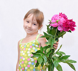 Image showing Child and flowerses
