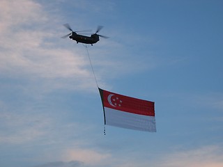 Image showing Copter Flying Singapore Flag