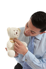 Image showing Salesman holding a teddy bear