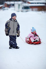 Image showing Two kids outdoors on winter day