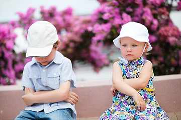 Image showing Two unhappy kids outdoors