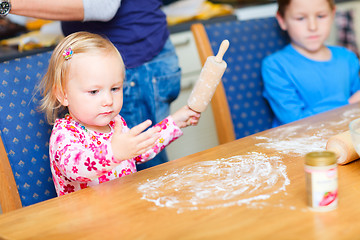 Image showing Two kids baking