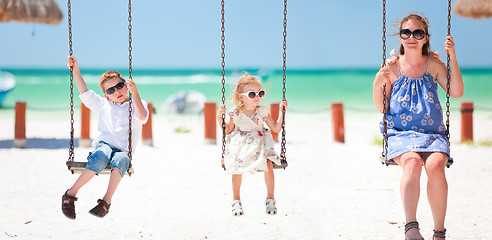 Image showing Family swinging