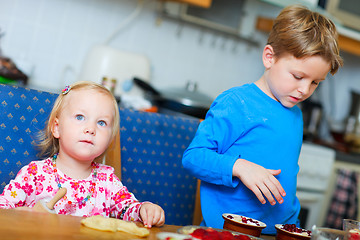 Image showing Two kids baking